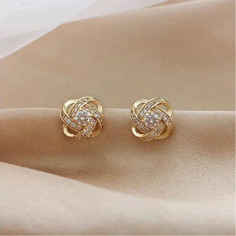 Gouden spiralen oorbellen met kristallen