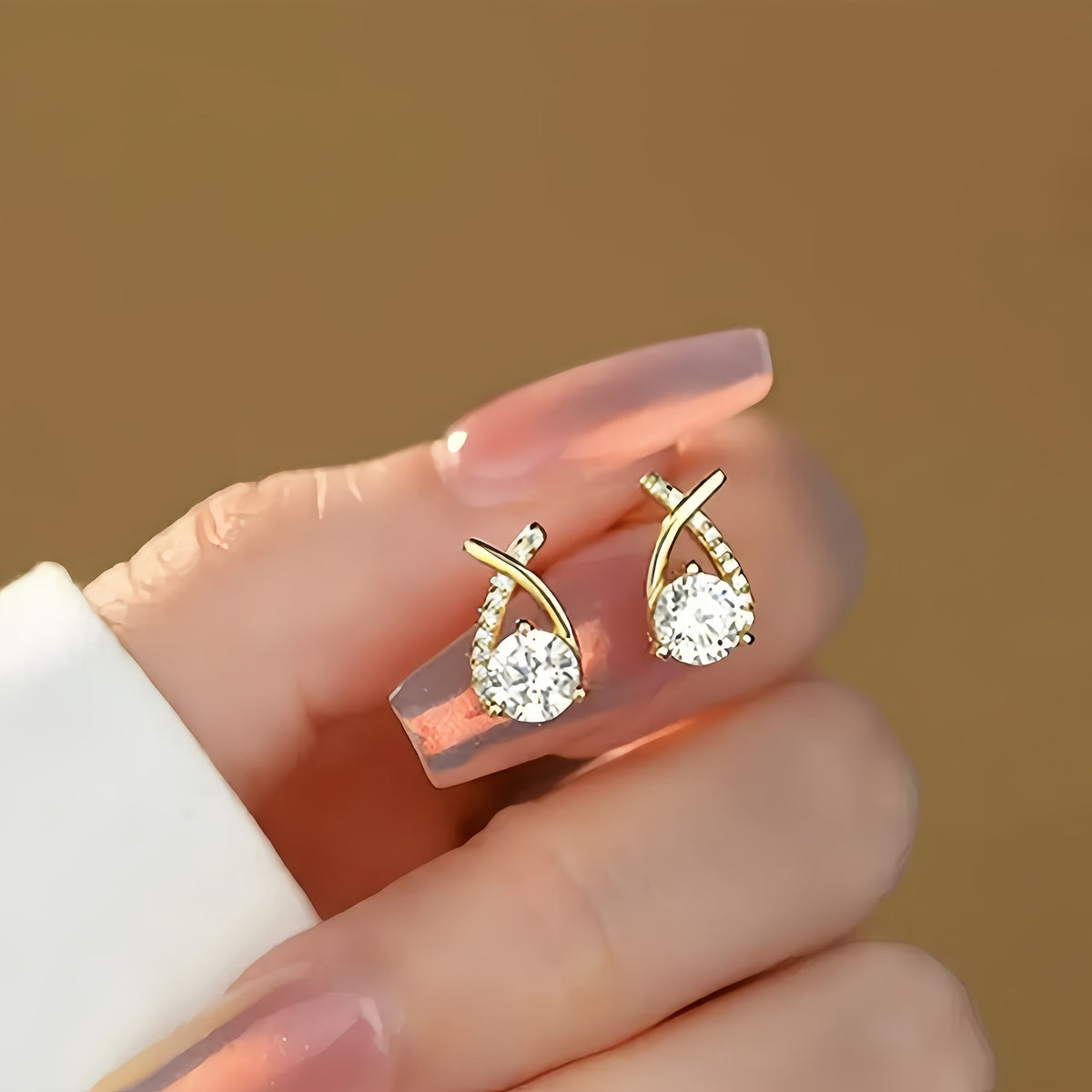 Oorbellen met gouden kruis en zirkonia |