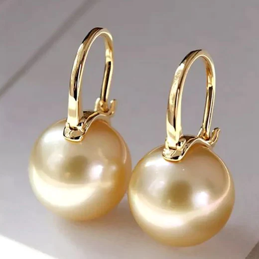 Elegante oorbellen in goud met parels
